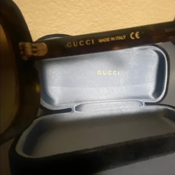 Authentic Brand new with no tags Gucci Sunglasses, brown. With sunglass case